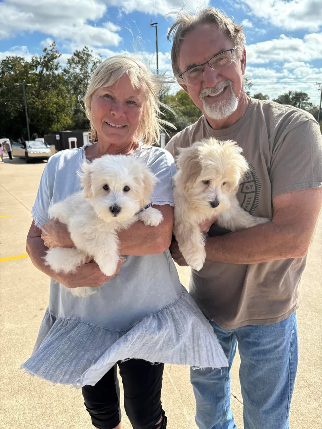 A couple with their two Cotons