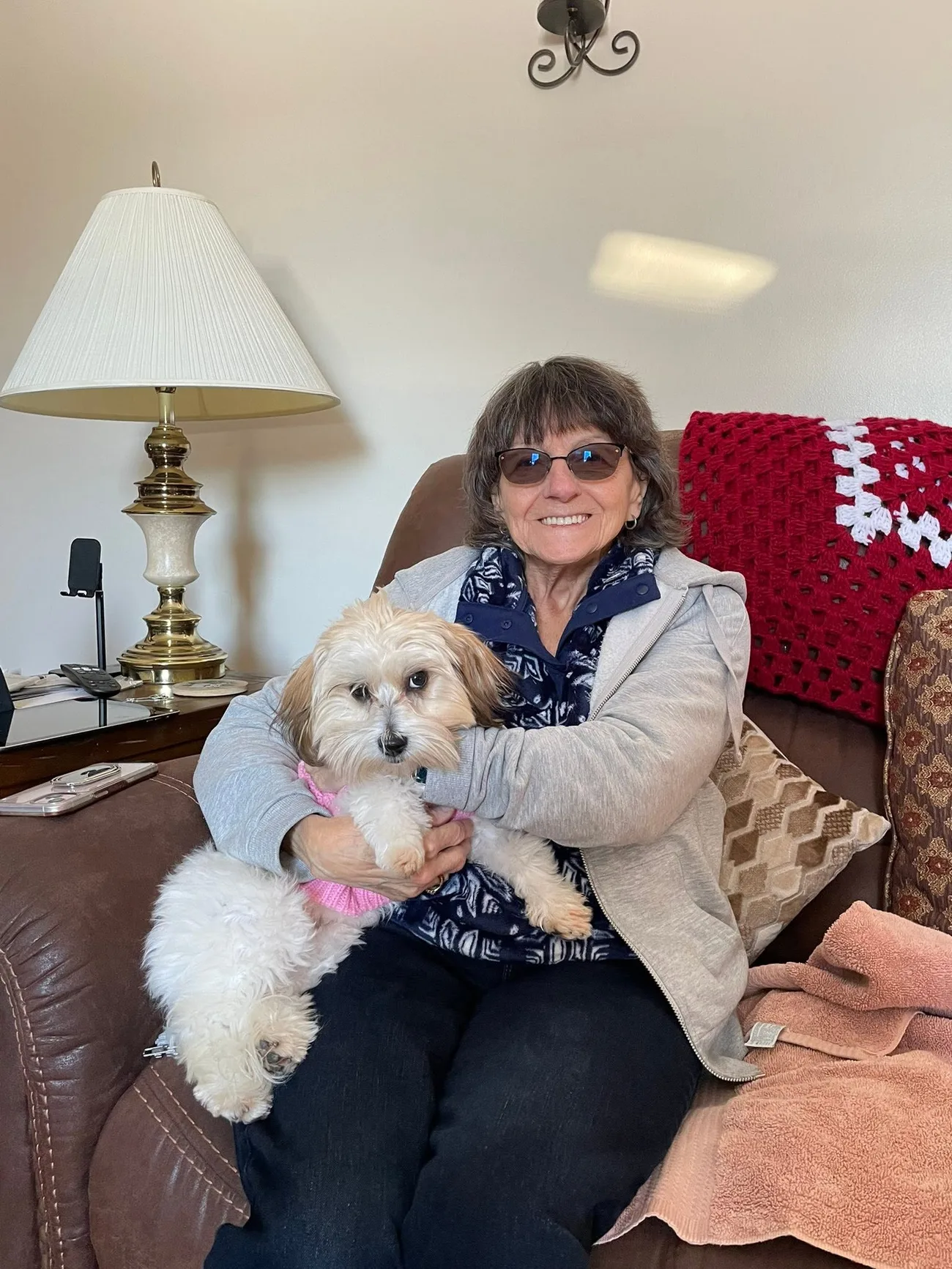Deana of Hope Cotons with a few of her Coton puppies at home